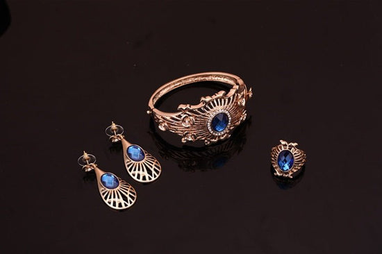 Necklace, earrings, bracelet, ring set $39.11 Dana Fashion Color: Blue Women's Accessories Style: European and American Material: Alloy Processing technology: diamond High-end necklace, earrings, bracelet, ring set, ladies party, alloy, four-piece jewelry
