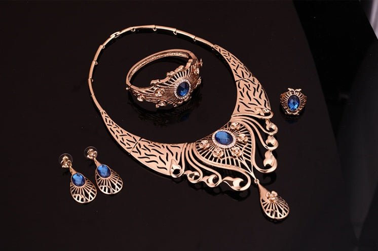 Necklace, earrings, bracelet, ring set $39.11 Dana Fashion Color: Blue Women's Accessories Style: European and American Material: Alloy Processing technology: diamond High-end necklace, earrings, bracelet, ring set, ladies party, alloy, four-piece jewelry