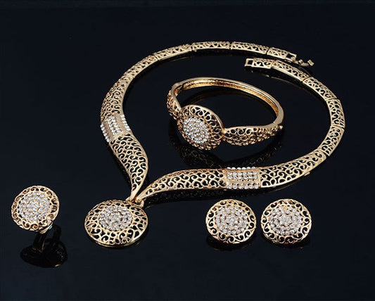 Necklace earrings ring jewelry four piece set $29.00 Dana Fashion Color: Gold Women's Accessories Process: Diamond Set combination: earrings + items + hand accessories Occasions for gifts: employee benefits, weddings, travel memorials Setting material: al