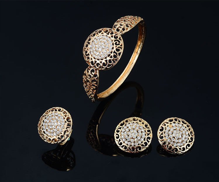 Necklace earrings ring jewelry four piece set $29.00 Dana Fashion Color: Gold Women's Accessories Process: Diamond Set combination: earrings + items + hand accessories Occasions for gifts: employee benefits, weddings, travel memorials Setting material: al