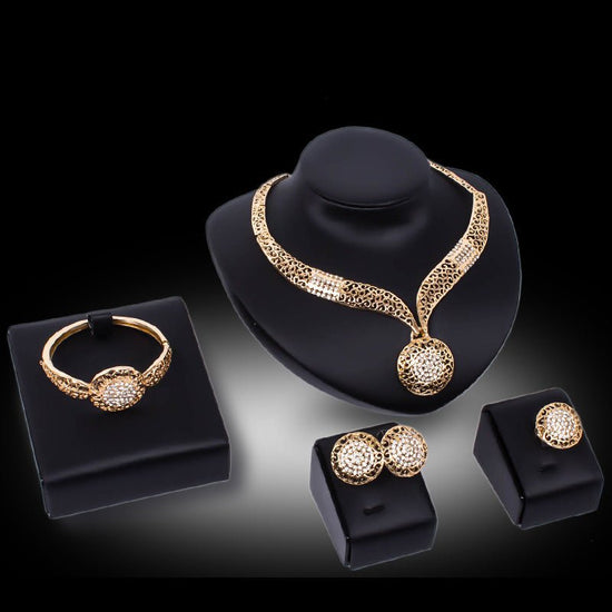 Necklace earrings ring jewelry four piece set $29.00 Dana Fashion Color: Gold Women's Accessories Process: Diamond Set combination: earrings + items + hand accessories Occasions for gifts: employee benefits, weddings, travel memorials Setting material: al