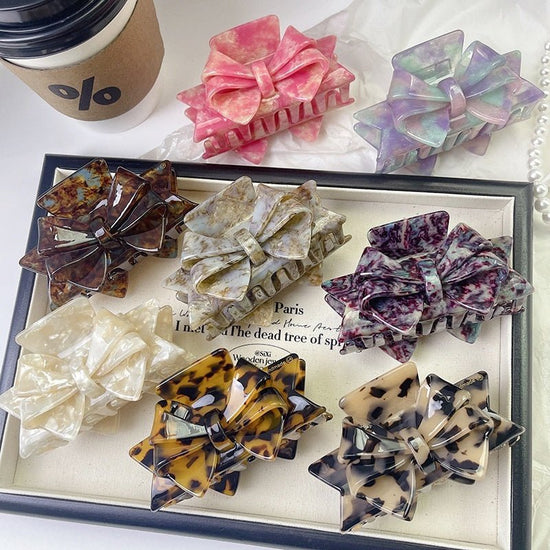 New Autumn And Winter High Sense Bow Claw Clip $18.00 Dana Fashion Color: 1 Purple Women's Accessories Product information: Processing Technology: Handmade Color: 1# purple, 2# blue brown, 3# textured blue, 4# leopard print, 5# starry sky purple, 6# Pink,