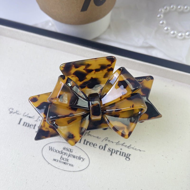 New Autumn And Winter High Sense Bow Claw Clip $18.00 Dana Fashion Color: 4 Leopard Print Women's Accessories Product information: Processing Technology: Handmade Color: 1# purple, 2# blue brown, 3# textured blue, 4# leopard print, 5# starry sky purple, 6