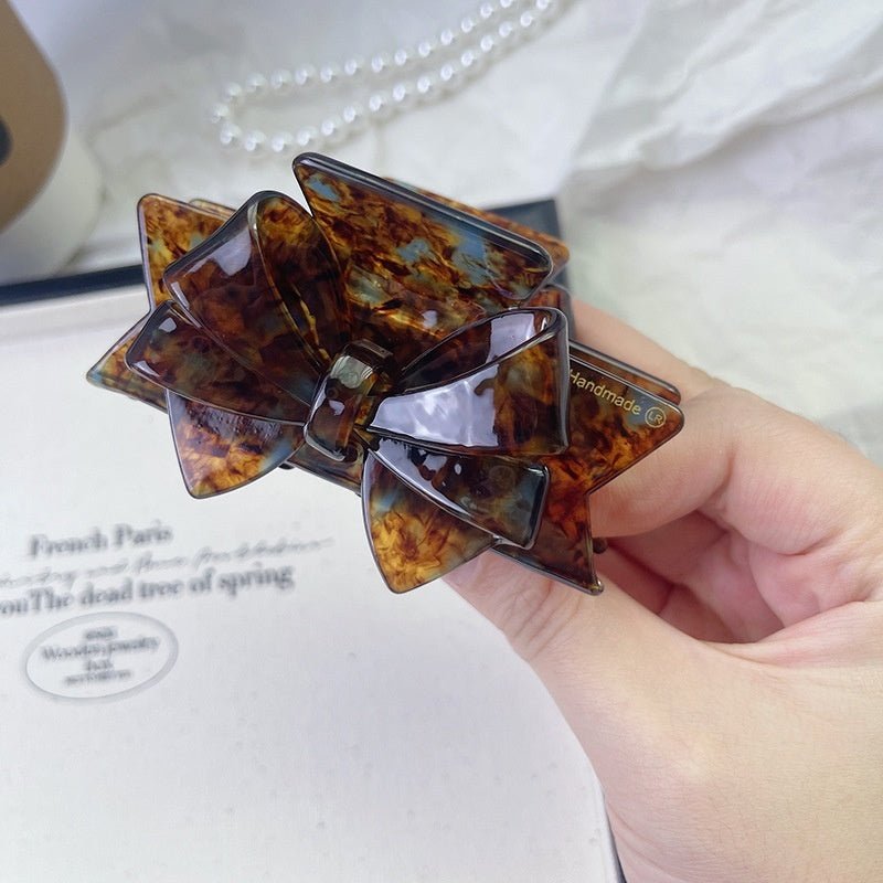 New Autumn And Winter High Sense Bow Claw Clip $18.00 Dana Fashion Color: 1 Purple Women's Accessories Product information: Processing Technology: Handmade Color: 1# purple, 2# blue brown, 3# textured blue, 4# leopard print, 5# starry sky purple, 6# Pink,