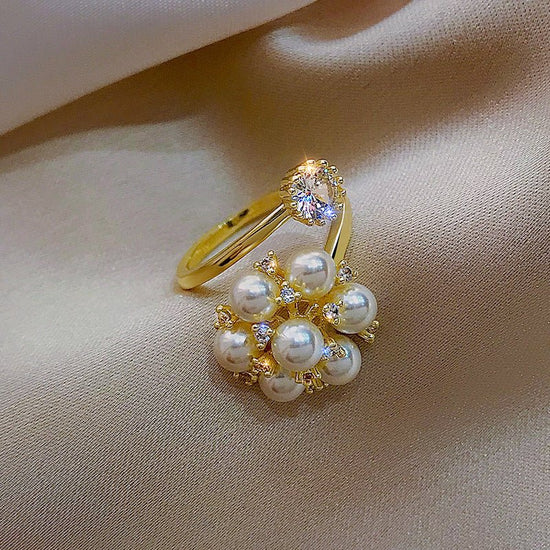 New Pearl Rhinestone Fashion Ring $15.69 Dana Fashion Color: Gold Size: Adjustable Opening Women's Accessories Product information: Type: open mouth Treatment Process: inlaid zircon Color: Gold Applicable population: Female Style: Female Material: Copper