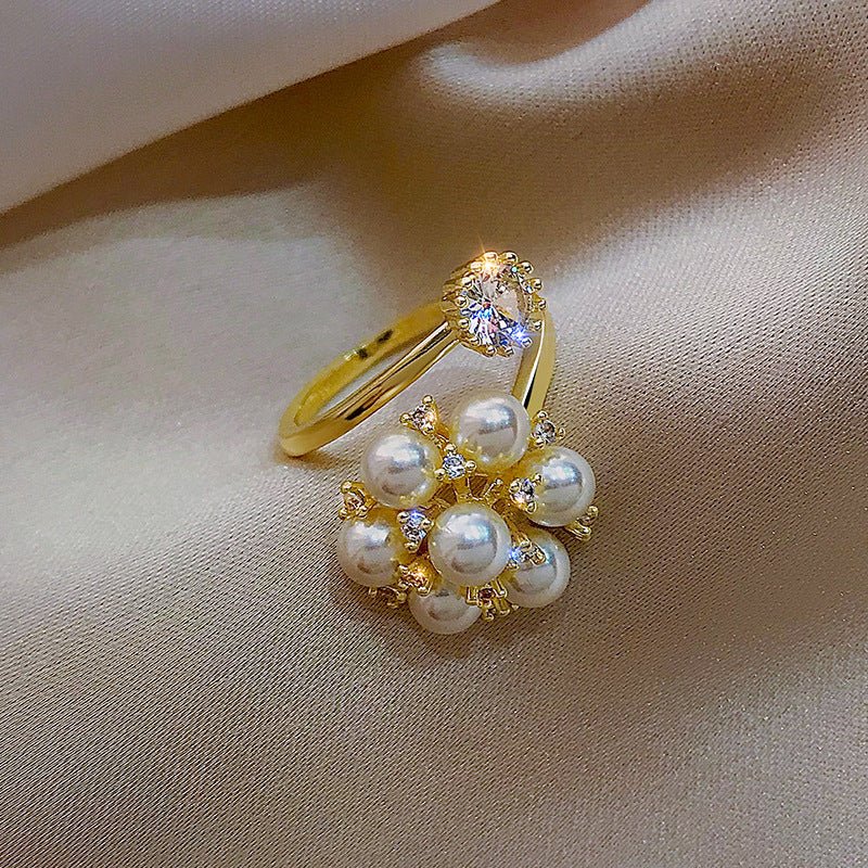 New Pearl Rhinestone Fashion Ring $15.69 Dana Fashion Color: Gold Size: Adjustable Opening Women's Accessories Product information: Type: open mouth Treatment Process: inlaid zircon Color: Gold Applicable population: Female Style: Female Material: Copper