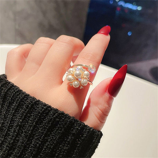 New Pearl Rhinestone Fashion Ring $15.69 Dana Fashion Color: Gold Size: Adjustable Opening Women's Accessories Product information: Type: open mouth Treatment Process: inlaid zircon Color: Gold Applicable population: Female Style: Female Material: Copper