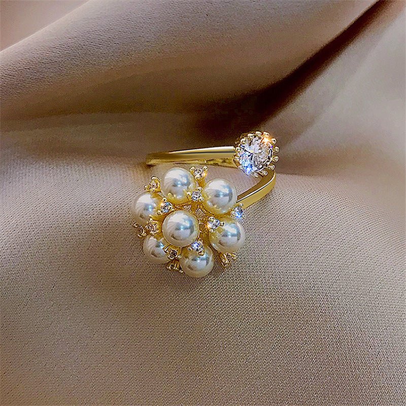 New Pearl Rhinestone Fashion Ring $15.69 Dana Fashion Color: Gold Size: Adjustable Opening Women's Accessories Product information: Type: open mouth Treatment Process: inlaid zircon Color: Gold Applicable population: Female Style: Female Material: Copper