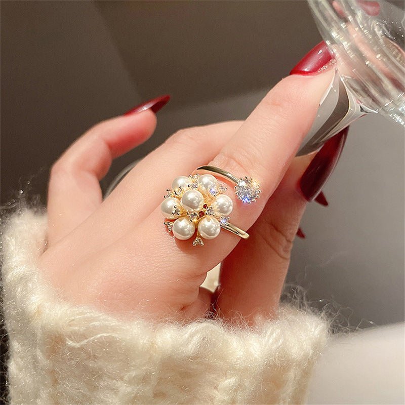 New Pearl Rhinestone Fashion Ring $15.69 Dana Fashion Color: Gold Size: Adjustable Opening Women's Accessories Product information: Type: open mouth Treatment Process: inlaid zircon Color: Gold Applicable population: Female Style: Female Material: Copper