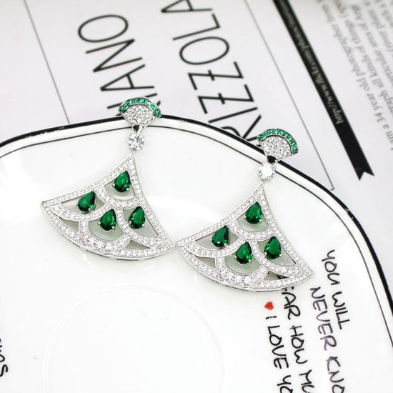 New Product Green Zircon Fan-shaped Earrings With Gold-plated Diamonds $39.00 Dana Fashion Color: Silver Women's Accessories Product information: Material; Yajin Style: European and American fashion OL Style: Women's Style: fan-shaped fan skirt Applicable
