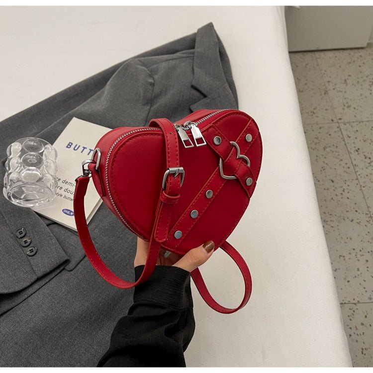 New Spring Trend Sense Cute Fashionable Shoulder Messenger Bag $31.08 Dana Fashion Color: Wine Red Women's Bags Product information: Lining text: Nylon Applicable scenarios: Daily match Color: black, cream white, silver, wine red Outer bag type: Pocket Sa