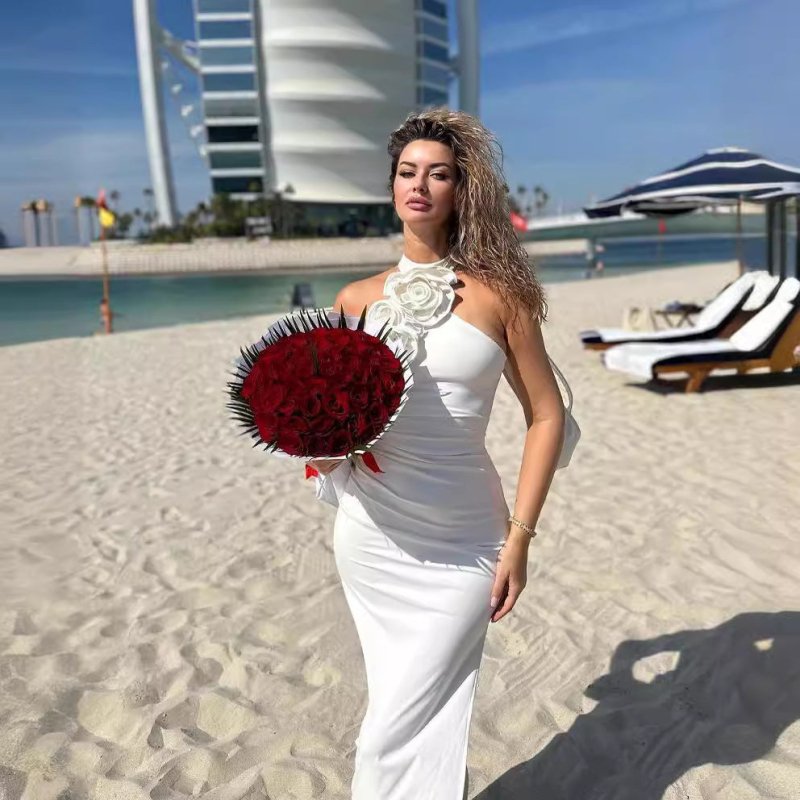 New Style White Ribbon Flower Halter Long High Sense Dress $145.00 Dana Fashion Color: Black Size: L Women's clothing Product information: Pattern: solid color Skirt-type: asymmetric skirt Color: white, black, red Waist type: elastic waist Size: XS,S,M,L