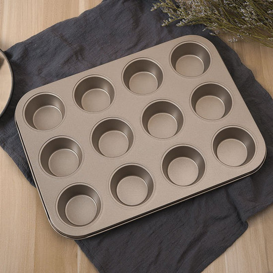 Oven Home Baking Tools Suit 12-piece Cake Mold $20.99 Dana Fashion Specifications: 12flat cup black Dana's Kitchen Product information: Purpose: View details Specifications: 6 consecutive cup molds, 12 consecutive cup molds, 6 consecutive cup molds/gold,