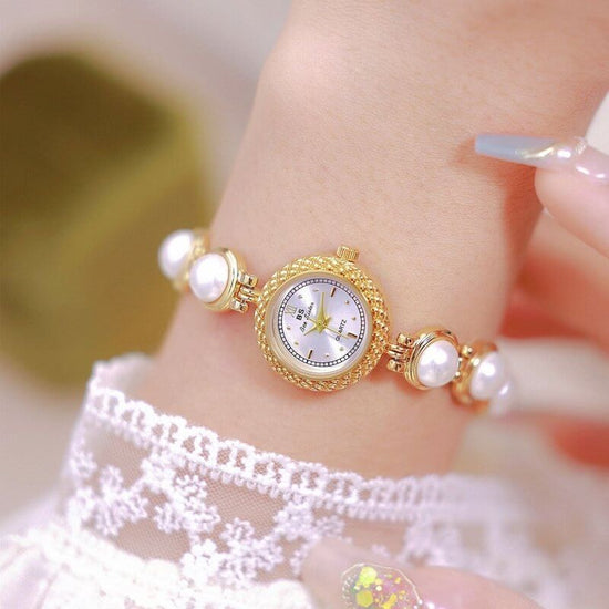 Pearl Bracelet Watch Temperament Women's Watch $35.50 Dana Fashion Color: Champagne Gold Surface Women's Accessories Product information: Material: electroplated alloy Surface: Sun pattern metal surface Watch cover: mineral reinforced glass Movement: quar