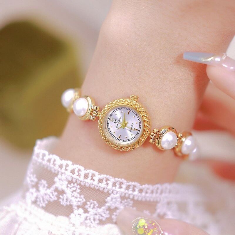 Pearl Bracelet Watch Temperament Women's Watch $35.50 Dana Fashion Color: Champagne Gold Surface Women's Accessories Product information: Material: electroplated alloy Surface: Sun pattern metal surface Watch cover: mineral reinforced glass Movement: quar