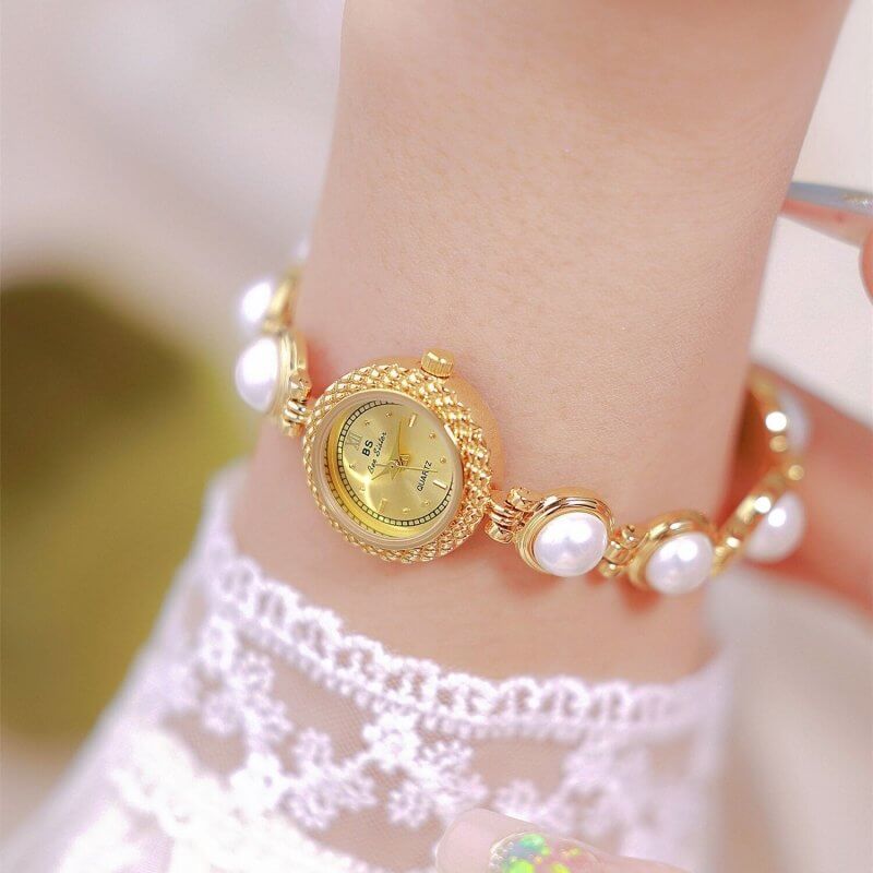 Pearl Bracelet Watch Temperament Women's Watch $35.50 Dana Fashion Color: Champagne Gold Surface Women's Accessories Product information: Material: electroplated alloy Surface: Sun pattern metal surface Watch cover: mineral reinforced glass Movement: quar