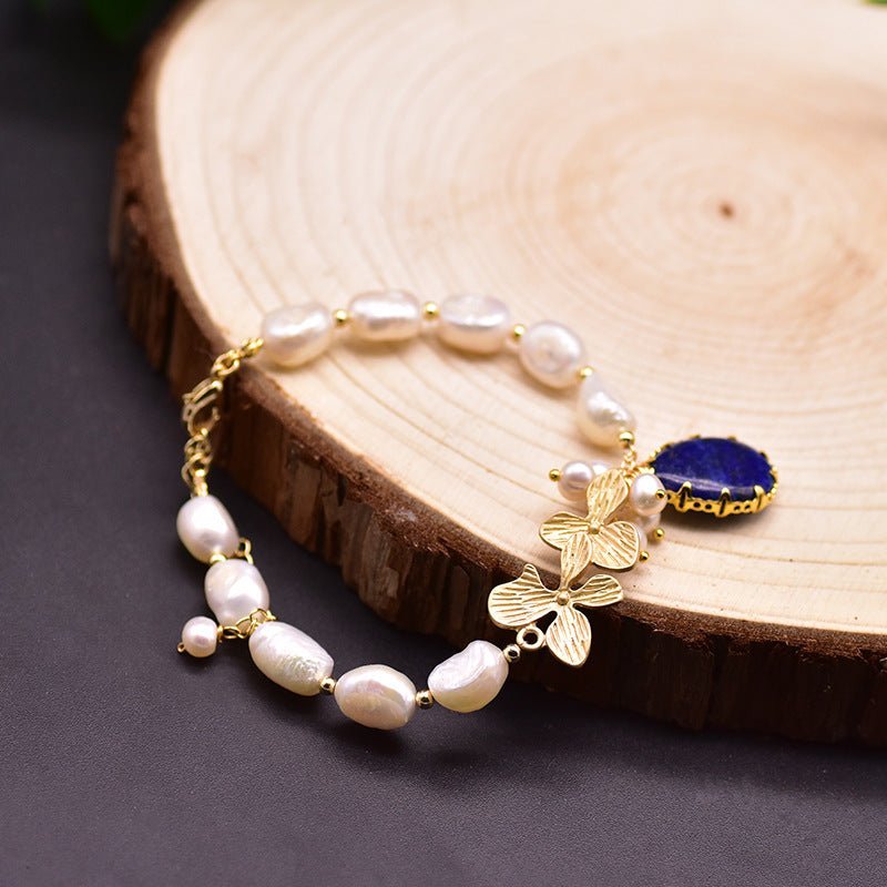 Pearl Bracelet Women's Design Sense Niche Turquoise $39.50 Dana Fashion Color: Lapis Lazuli Pearl Bracelet Women's Accessories Product information: Treatment Process: Electroplating Color: Turquoise Pearl bracelet, lapis lazuli pendant Clover pearl bracel