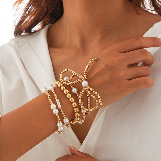 Personalized Bow Beaded Multi-layer Bracelet 5-piece Set $15.84 Dana Fashion Color: 01 Gold Women's Accessories Product information: Treatment Process: Electroplating Color: 01 Gold 5159 Applicable people: women Applicable occasions for gifts: travel comm