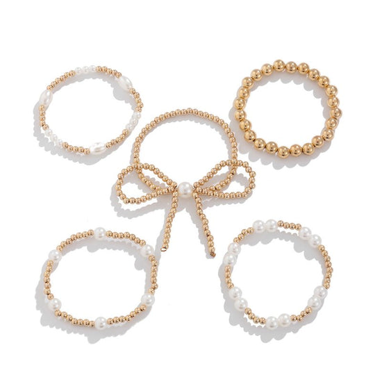 Personalized Bow Beaded Multi-layer Bracelet 5-piece Set $15.84 Dana Fashion Color: 01 Gold Women's Accessories Product information: Treatment Process: Electroplating Color: 01 Gold 5159 Applicable people: women Applicable occasions for gifts: travel comm