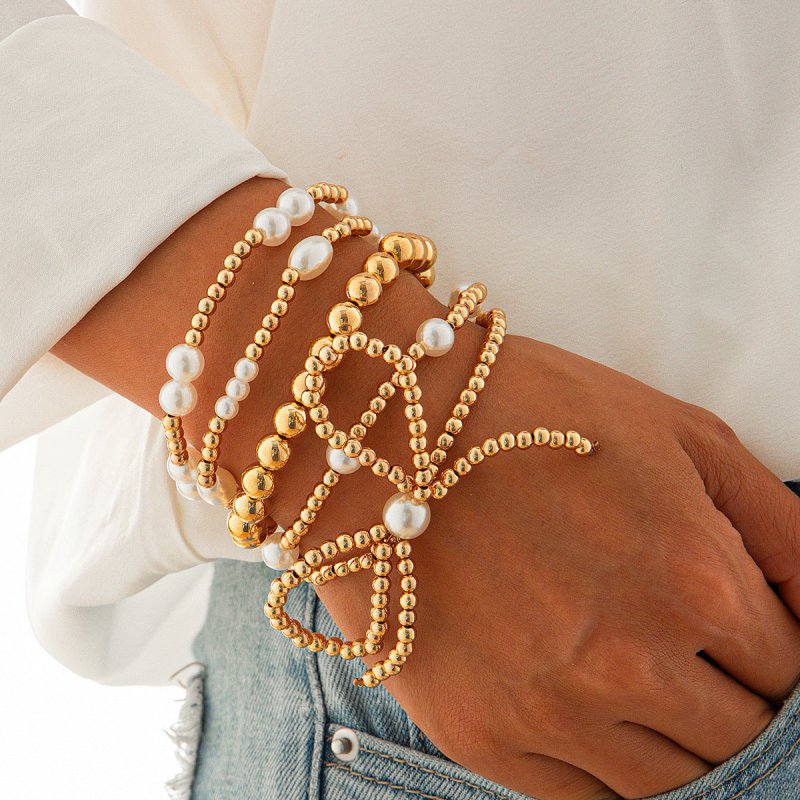 Personalized Bow Beaded Multi-layer Bracelet 5-piece Set $15.84 Dana Fashion Color: 01 Gold Women's Accessories Product information: Treatment Process: Electroplating Color: 01 Gold 5159 Applicable people: women Applicable occasions for gifts: travel comm