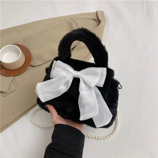 Plush Bag Commuter Pearl Hand Shoulder Messenger Bag $23.38 Dana Fashion Color: Black Women's Bags Product information: Applicable scenarios: Daily matching Color: black, white, brown, pink Outer bag type: open pocket Hardness: soft Material: Nylon Suitca