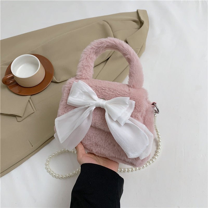 Plush Bag Commuter Pearl Hand Shoulder Messenger Bag $23.38 Dana Fashion Color: Pink Women's Bags Product information: Applicable scenarios: Daily matching Color: black, white, brown, pink Outer bag type: open pocket Hardness: soft Material: Nylon Suitcas