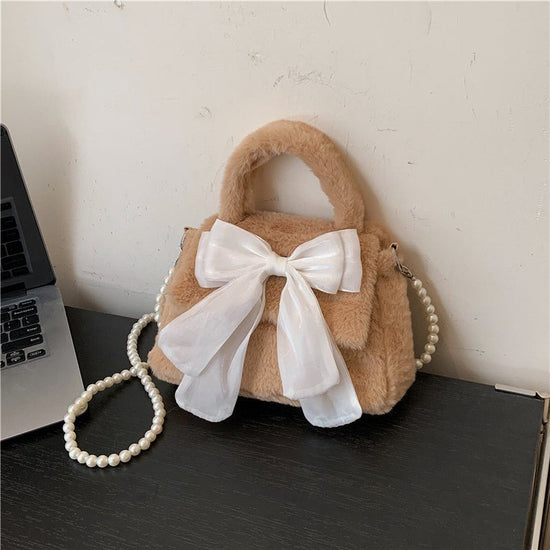 Plush Bag Commuter Pearl Hand Shoulder Messenger Bag $23.38 Dana Fashion Color: Brown Women's Bags Product information: Applicable scenarios: Daily matching Color: black, white, brown, pink Outer bag type: open pocket Hardness: soft Material: Nylon Suitca