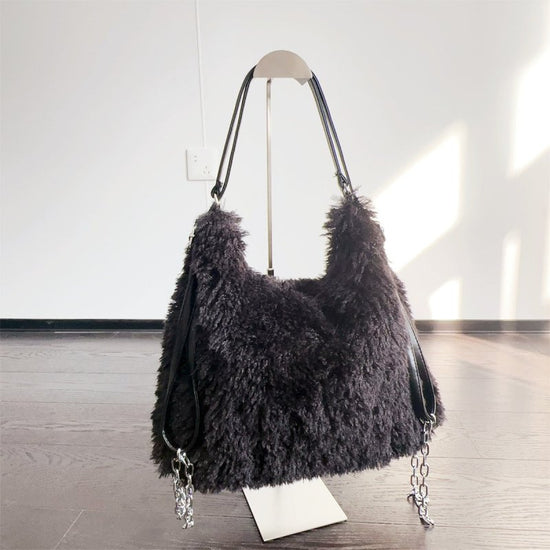 Plush Hand-carrying Bag Shoulder Large Capacity $58.37 Dana Fashion Color: Black Women's Bags Product information: Color: white, gray, khaki, camel, black Hardness: soft Material: Plush Suitcase shape: square vertical model Popular elements: sequins, maca