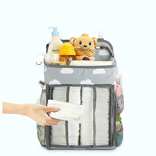 Portable Baby Crib Organizer Bed Hanging Bag $57.56 Dana Fashion Color: Gray Baby Clothing Overview Multifunctional bed hanging storage bags can be equipped with baby clothes, care products, urine pads, baby bottles, tissue box toys, etc. Store all the su