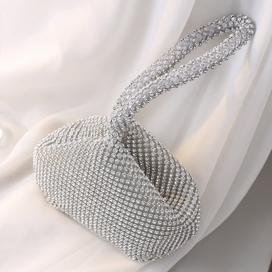 Portable Rhinestone Party Evening Bags $50.00 Dana Fashion Color: Black Size: Large Women's Bags Material: Silk Fabric texture: polyester Lining texture: polyester Bag shape: dumpling type Color: black, silver, gold, champagne