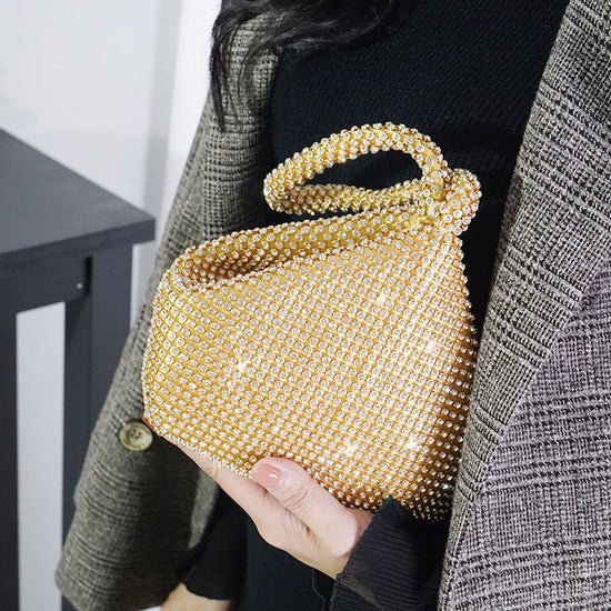Portable Rhinestone Party Evening Bags $50.00 Dana Fashion Color: Gold Size: Large Women's Bags Material: Silk Fabric texture: polyester Lining texture: polyester Bag shape: dumpling type Color: black, silver, gold, champagne