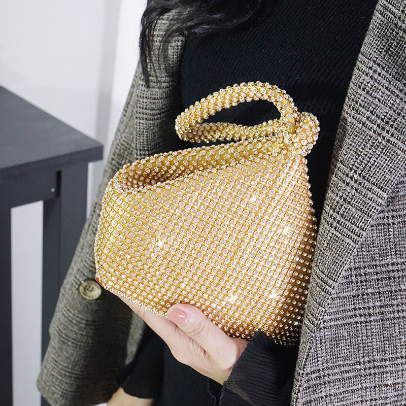 Portable Rhinestone Party Evening Bags $50.00 Dana Fashion Color: Gold Size: Large Women's Bags Material: Silk Fabric texture: polyester Lining texture: polyester Bag shape: dumpling type Color: black, silver, gold, champagne