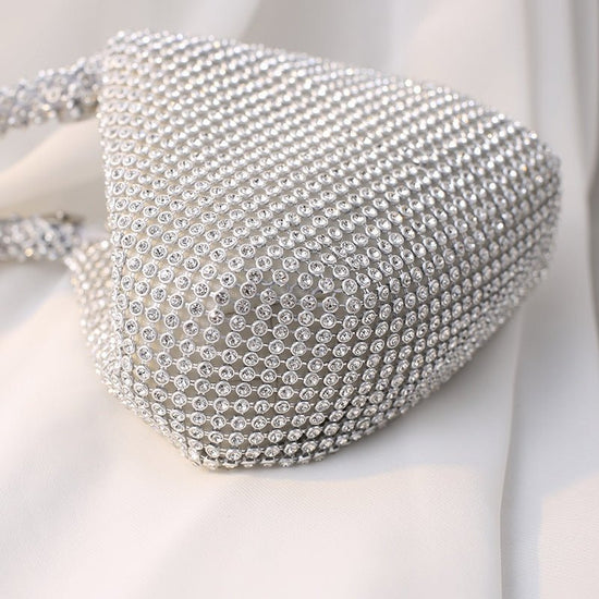 Portable Rhinestone Party Evening Bags $50.00 Dana Fashion Color: Black Size: Large Women's Bags Material: Silk Fabric texture: polyester Lining texture: polyester Bag shape: dumpling type Color: black, silver, gold, champagne