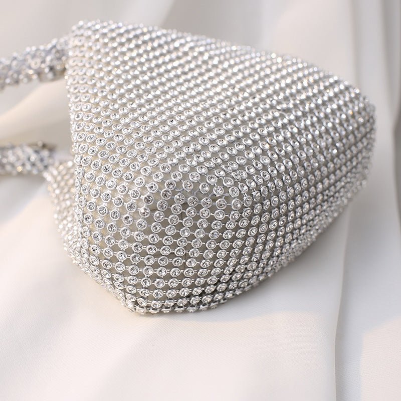 Portable Rhinestone Party Evening Bags $50.00 Dana Fashion Color: Black Size: Large Women's Bags Material: Silk Fabric texture: polyester Lining texture: polyester Bag shape: dumpling type Color: black, silver, gold, champagne
