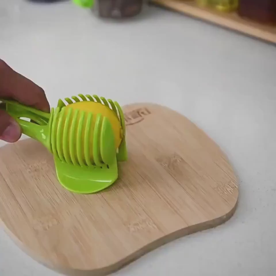 Fruit & Veggie Cutting Holder $15.00 Dana Fashion Color: Black Dana's Kitchen Feature Made from high duty plastic material Creative design / Eco-friendly / non-toxic Quick & easy to use and clean. Specification 100% brand new and high quality Size:( 18.5*