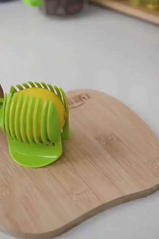 Fruit & Veggie Cutting Holder $15.00 Dana Fashion Color: Black Dana's Kitchen Feature Made from high duty plastic material Creative design / Eco-friendly / non-toxic Quick & easy to use and clean. Specification 100% brand new and high quality Size:( 18.5*