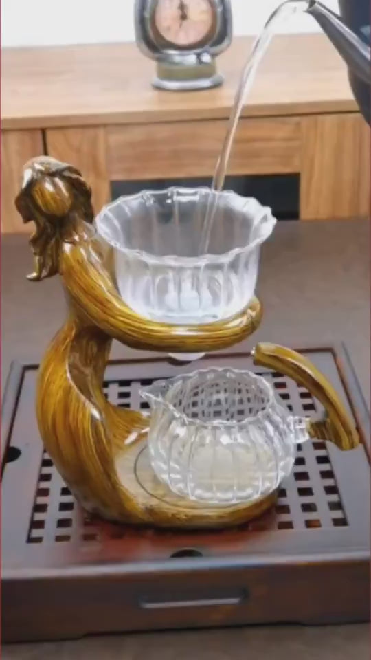 Maid Semi-automatic Tea Set Tea Making Kungfu Teapot Automatic Tea Set Heat-resistant Glass Holder Base Tea Infusers Tea Ware $197.50 Dana Fashion Color: Style1 Dana's Kitchen Overview: MATERIAL: This glass teapot set is made of durable borosilicate glass