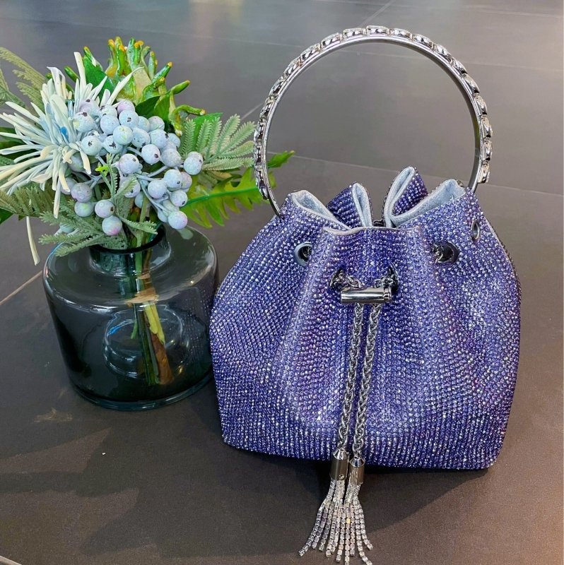 Rainbow Tassel Shiny Hand Diamond Bag $59.00 Dana Fashion Color: Purple Size: L Women's Bags Specifications: Color: Pink, pink, blue, purple, black, yellow, rainbow, multicolored, braided green, green diamond Style: Street trend Material: Acrylic Popular
