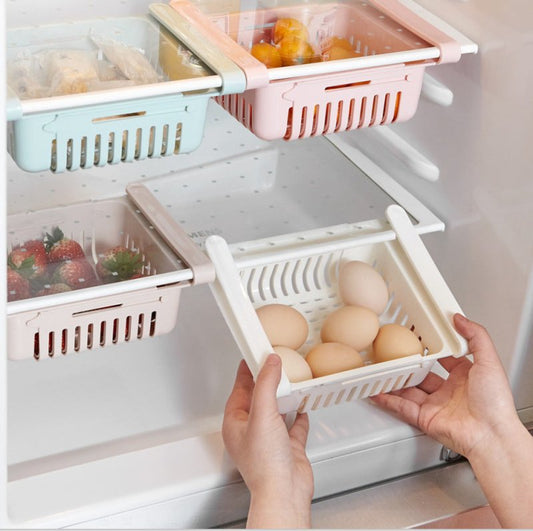 Refrigerator Storage Basket Stretchable Multifunction Kitchen Refrigerator Storage Box $25.87 Dana Fashion Color: 2PC White1 Dana's Kitchen Overview: 1. Stretchable Design: You can adjust the holder according to the size of your belongings 2. Durable: Mad