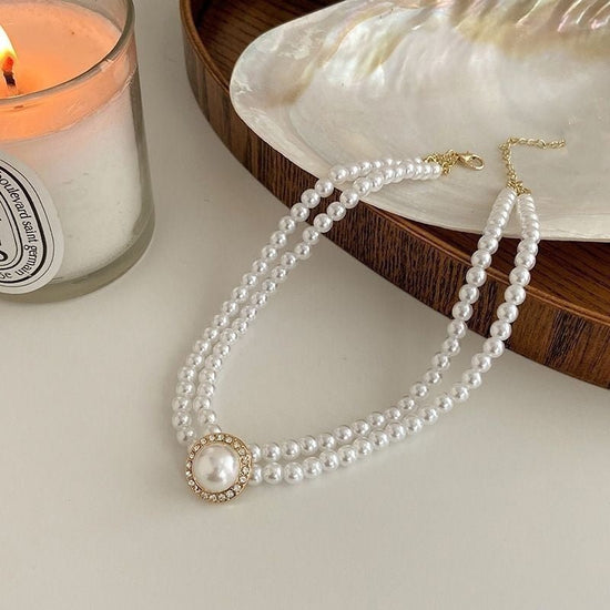 Retro Court Rhinestone Pearl Necklace Ear Stud Women's Simple $11.33 Dana Fashion Style: Necklace Women's Accessories Product information: Processing Technology: manual Color: necklace C047, stud earrings B306, ring D031 Pendant material: Mother Pearl she