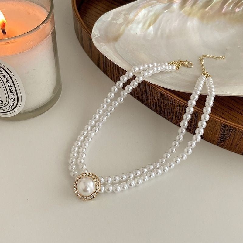 Retro Court Rhinestone Pearl Necklace Ear Stud Women's Simple $11.33 Dana Fashion Style: Necklace Women's Accessories Product information: Processing Technology: manual Color: necklace C047, stud earrings B306, ring D031 Pendant material: Mother Pearl she