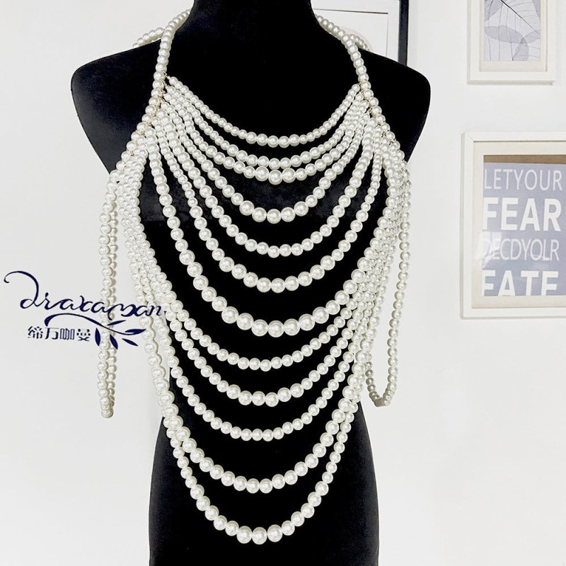 Retro Multi-layer Pearl Body Chains $45.00 Dana Fashion Color: Black And White Women's Accessories Product information: Treatment Process: hand-woven Color: white, black and white Pendant material: Imitation Pearl Chain style: ball bead necklace Material: