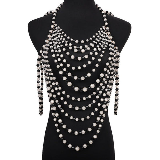 Retro Multi-layer Pearl Body Chains $45.00 Dana Fashion Color: Black And White Women's Accessories Product information: Treatment Process: hand-woven Color: white, black and white Pendant material: Imitation Pearl Chain style: ball bead necklace Material: