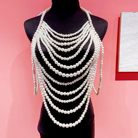 Retro Multi-layer Pearl Body Chains $45.00 Dana Fashion Color: Black And White Women's Accessories Product information: Treatment Process: hand-woven Color: white, black and white Pendant material: Imitation Pearl Chain style: ball bead necklace Material: