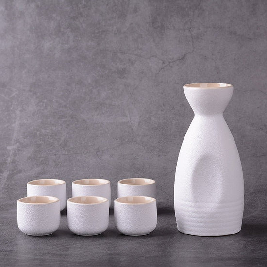 Sakura vintage sake set $28.04 Dana Fashion Color: Sake White Dana's Kitchen Material: Ceramic Capacity: Wine glass capacity 30ml Sake kettle capacity 250ml Triangle wine pot capacity 150ml Style: Japanese style Size: wine coarse pottery pot 1 4 cups with