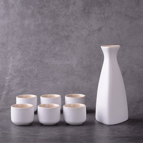 Sakura vintage sake set $28.04 Dana Fashion Color: Riangle White Dana's Kitchen Material: Ceramic Capacity: Wine glass capacity 30ml Sake kettle capacity 250ml Triangle wine pot capacity 150ml Style: Japanese style Size: wine coarse pottery pot 1 4 cups w