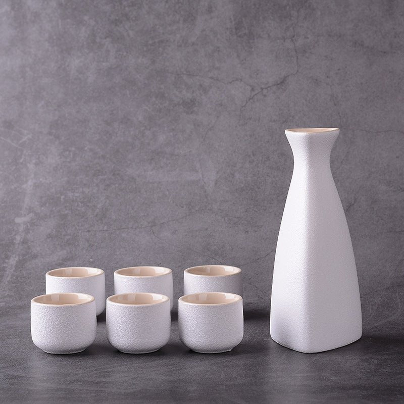 Sakura vintage sake set $28.04 Dana Fashion Color: Riangle White Dana's Kitchen Material: Ceramic Capacity: Wine glass capacity 30ml Sake kettle capacity 250ml Triangle wine pot capacity 150ml Style: Japanese style Size: wine coarse pottery pot 1 4 cups w