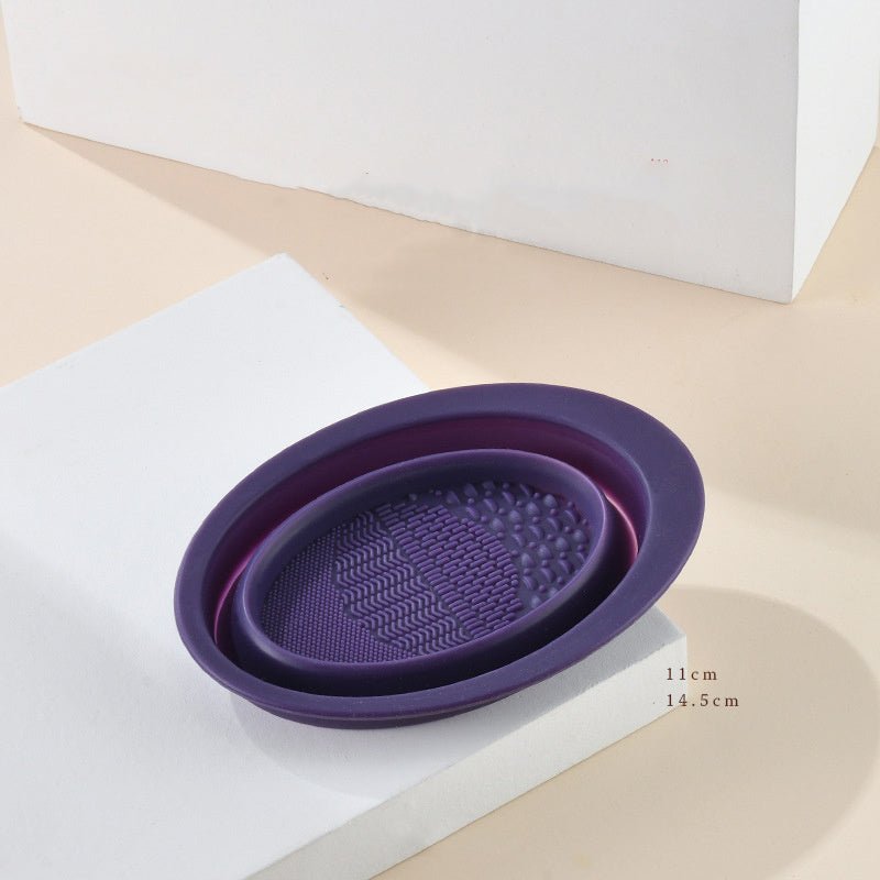 Scrubbing Plate Makeup Brush Cleaning Pad Makeup Brush Cleaning Bowl $24.00 Dana Fashion Color: Dark Purple makeup Product Information Name: Makeup brush folding cleaning bowl Material: Silicone Be applicable: DIY facial mask Brewing water film Soaking be