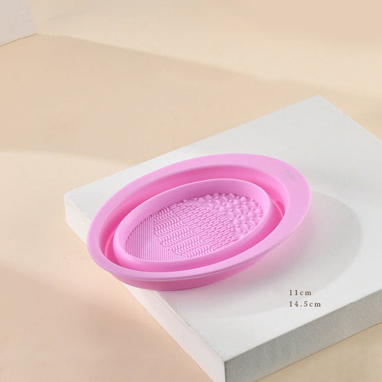 Scrubbing Plate Makeup Brush Cleaning Pad Makeup Brush Cleaning Bowl $24.00 Dana Fashion Color: Dark Purple makeup Product Information Name: Makeup brush folding cleaning bowl Material: Silicone Be applicable: DIY facial mask Brewing water film Soaking be