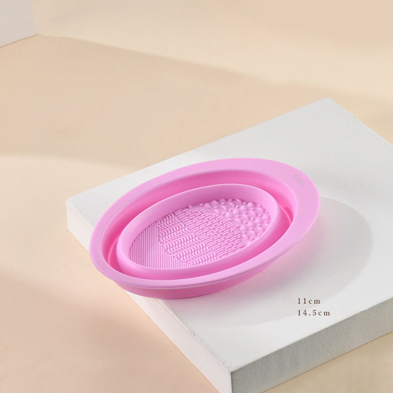 Scrubbing Plate Makeup Brush Cleaning Pad Makeup Brush Cleaning Bowl $24.00 Dana Fashion Color: Dark Purple makeup Product Information Name: Makeup brush folding cleaning bowl Material: Silicone Be applicable: DIY facial mask Brewing water film Soaking be
